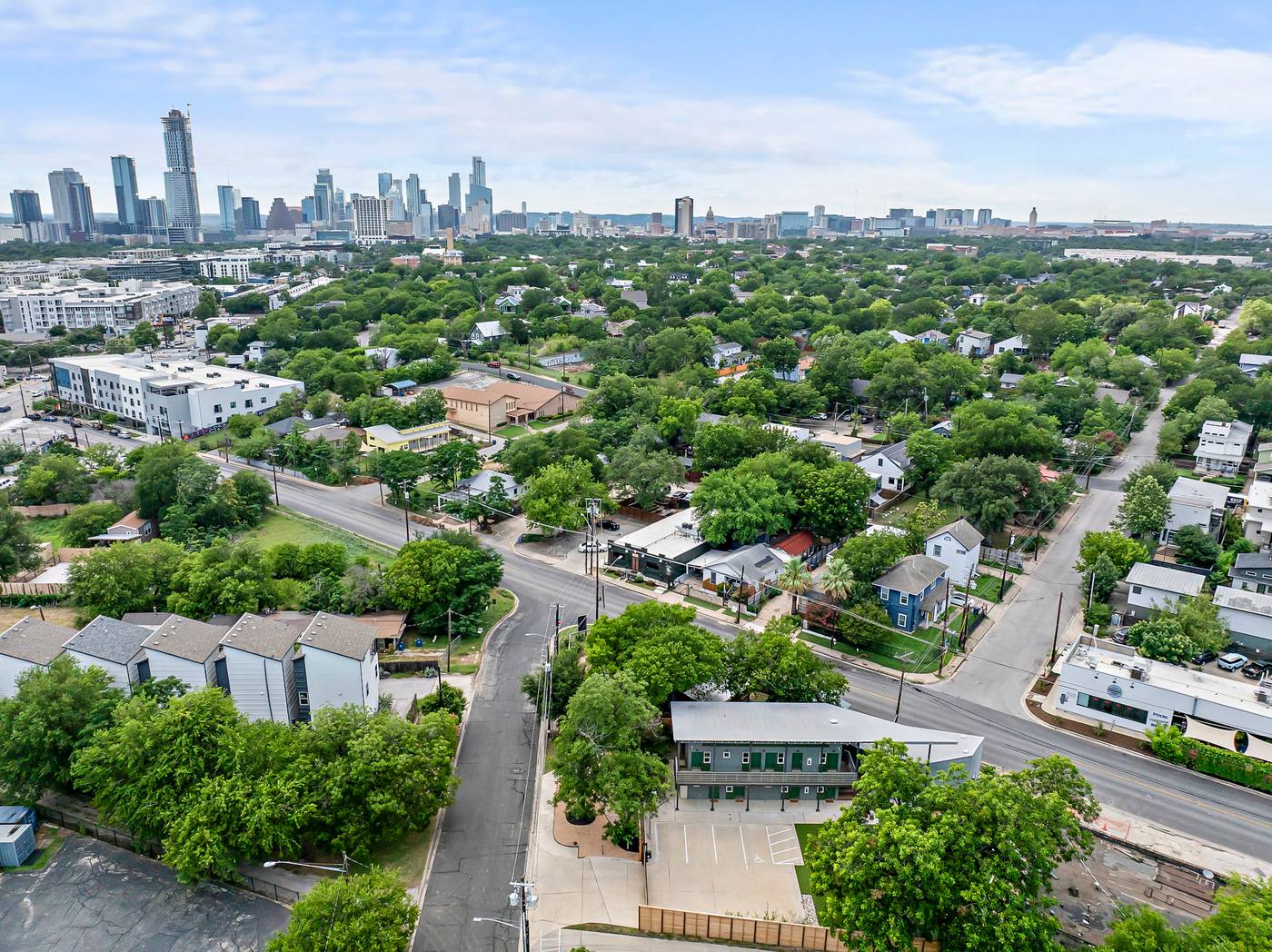 Aerial view of East Austin with the downtown skyline on the horizon